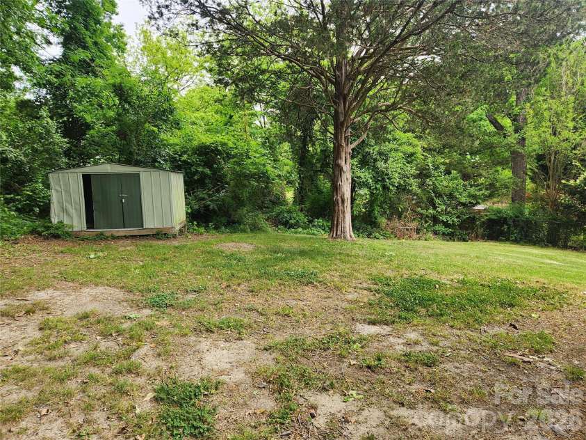 1404 Mauney Avenue, Gastonia, NC 28052.  MLS# CAR4374899, YatesRealty ID 17187. Back yard with shed