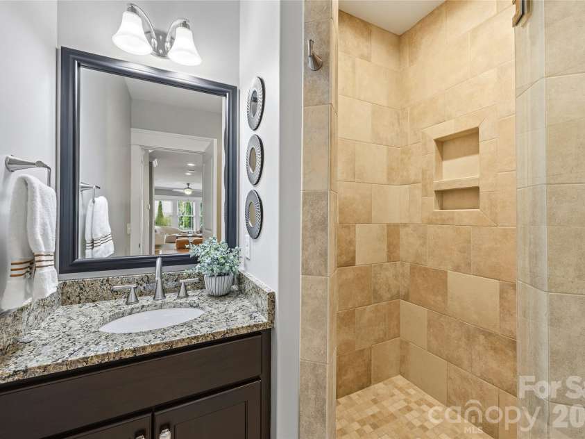 30 Stills Creek Loop, Fairview, NC 28730.  MLS# CAR4353771, YatesRealty ID 17188. Downstairs guest bath