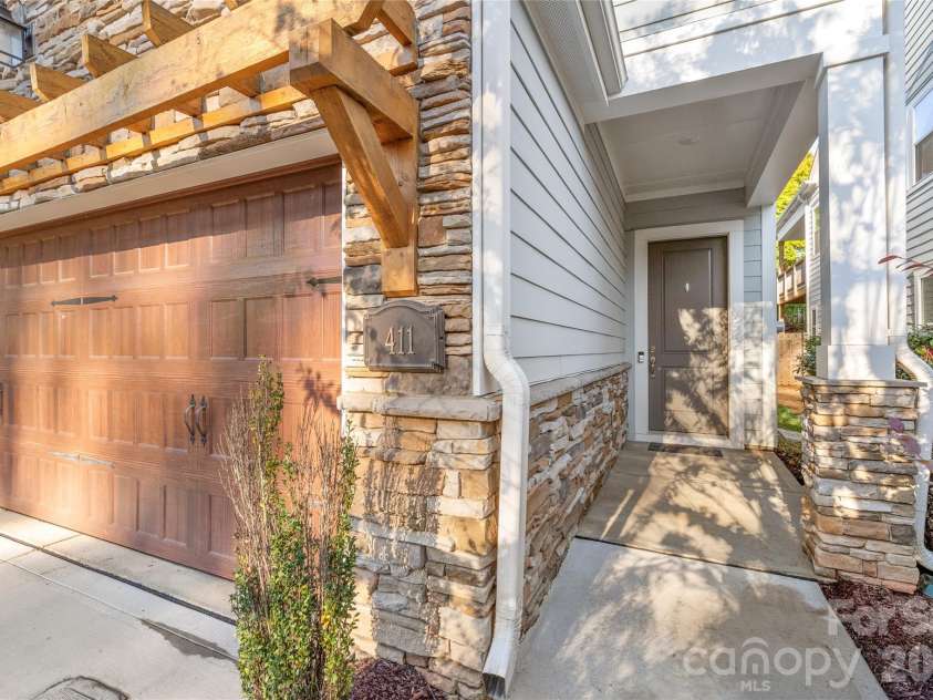 411 Belton Street, Charlotte, NC 28209.  MLS# CAR4321222, YatesRealty ID 17202. Beautifully crafted exterior with durable cement siding and stone accents for timeless curb appeal and easy maintenance.