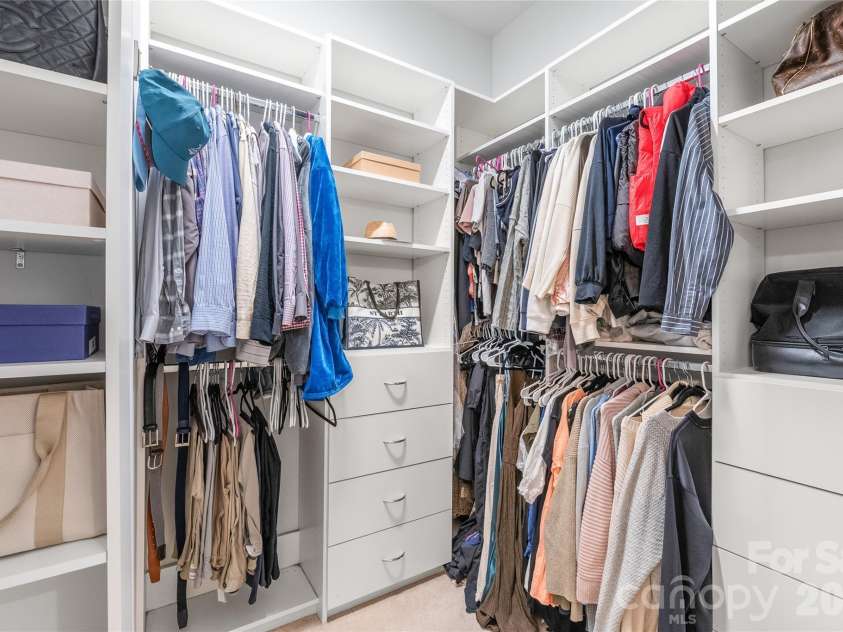 411 Belton Street, Charlotte, NC 28209.  MLS# CAR4321222, YatesRealty ID 17202. Closet goals! Custom walk-in design keeps everything organized and easy to access.