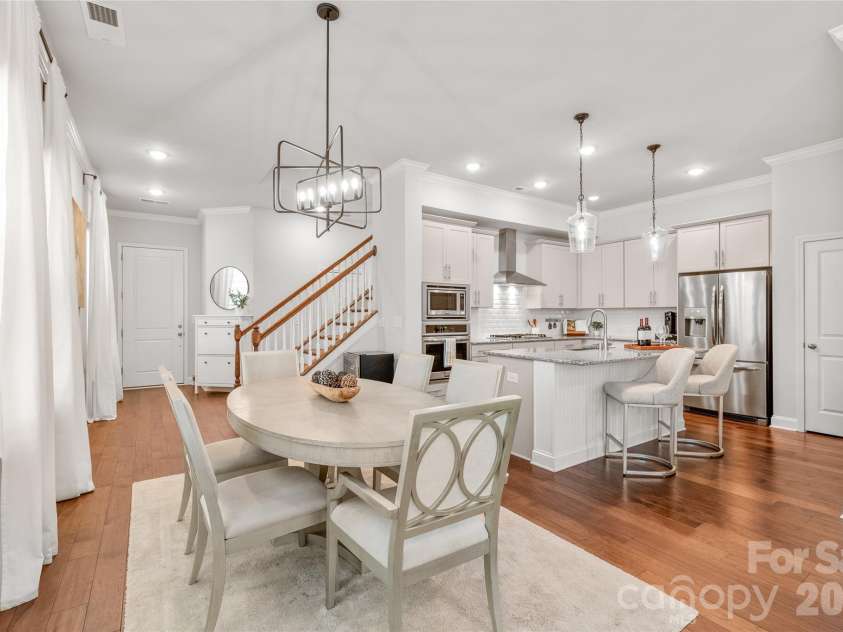411 Belton Street, Charlotte, NC 28209.  MLS# CAR4321222, YatesRealty ID 17202. Elegant dining area enhanced with designer lighting — perfect for meals and entertaining.
