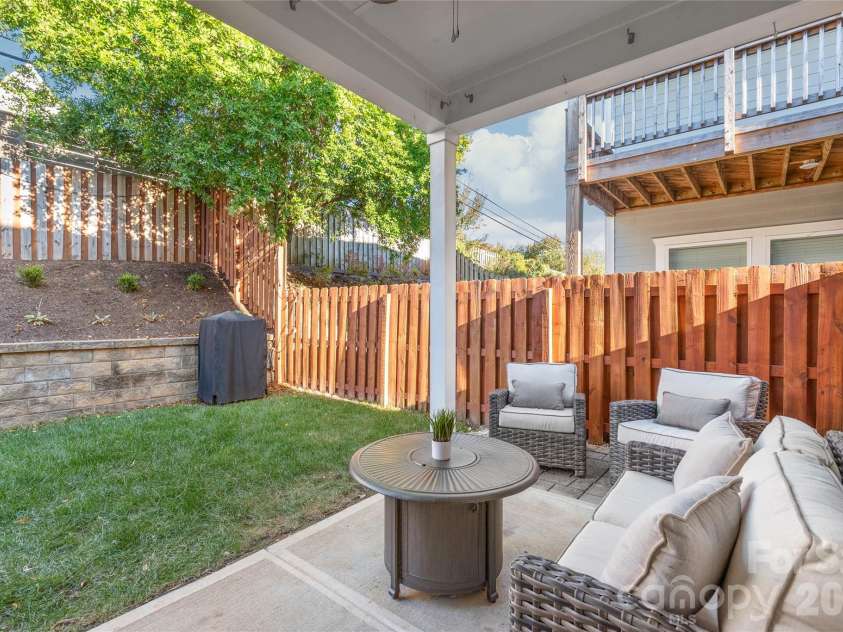 411 Belton Street, Charlotte, NC 28209.  MLS# CAR4321222, YatesRealty ID 17202. Grill, chill, repeat! Covered porch and fenced backyard make entertaining a breeze.