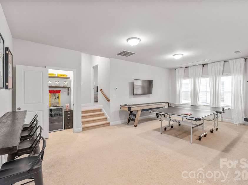 411 Belton Street, Charlotte, NC 28209.  MLS# CAR4321222, YatesRealty ID 17202. Guests will feel right at home! Head up a couple steps to a private guest suite with a full bath, making every visit extra special.