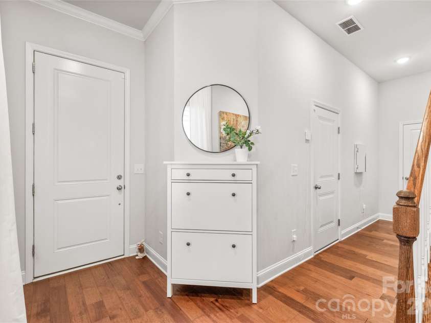 411 Belton Street, Charlotte, NC 28209.  MLS# CAR4321222, YatesRealty ID 17202. Spacious 2-car garage with sleek epoxy floors — durable, clean, and ready for your next project.