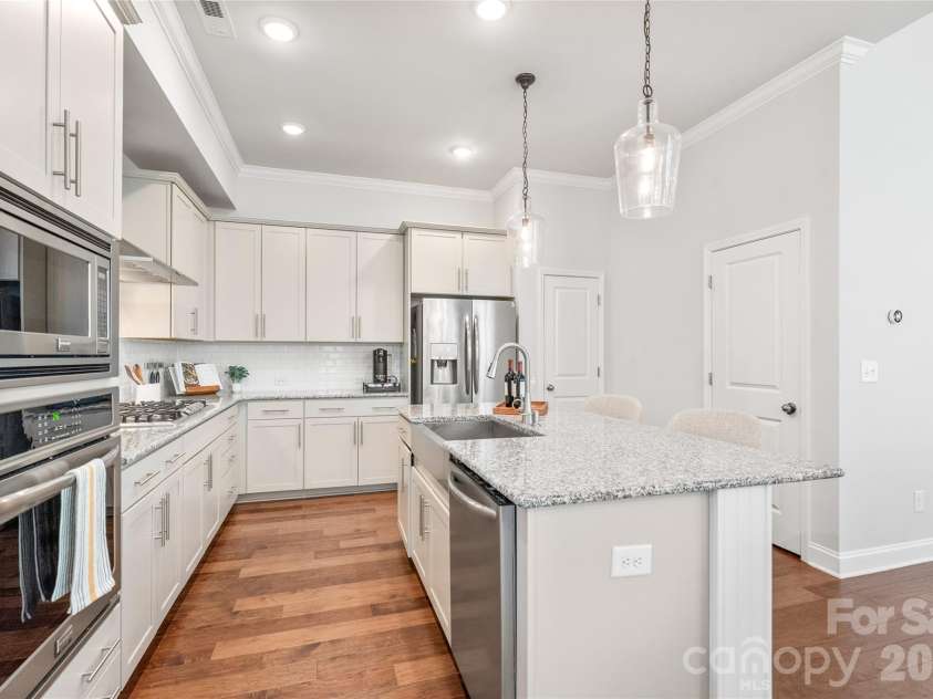 411 Belton Street, Charlotte, NC 28209.  MLS# CAR4321222, YatesRealty ID 17202. Spacious center island — perfect for meal prep, entertaining, and everyday living.