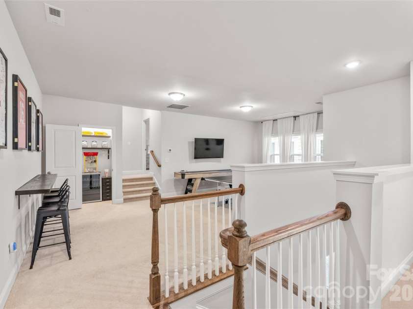 411 Belton Street, Charlotte, NC 28209.  MLS# CAR4321222, YatesRealty ID 17202. Spacious loft/rec room offers a versatile second living area..perfect for a game room, media space, or hangout.