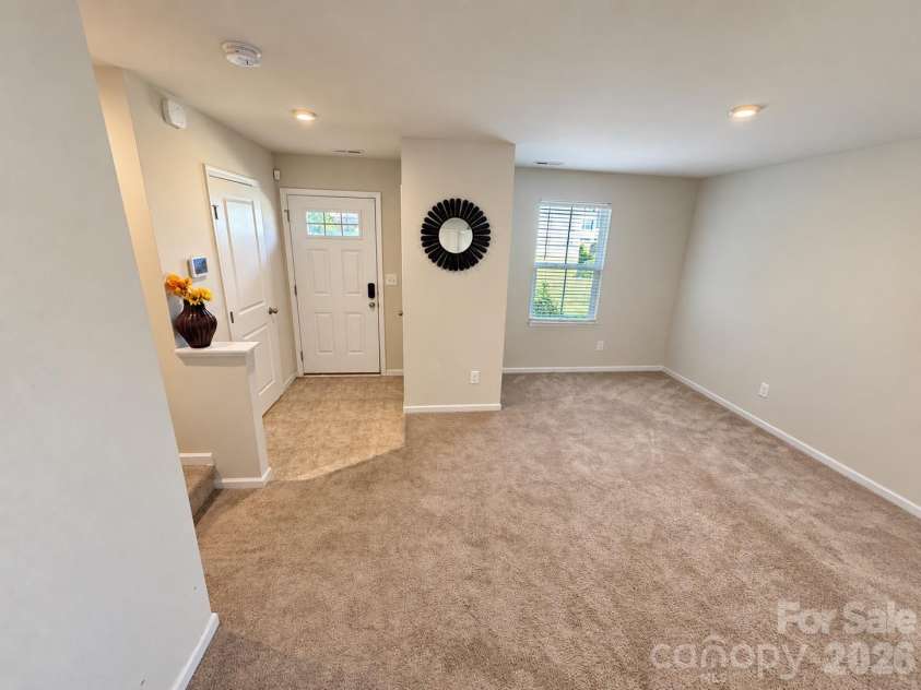 5356 Austin Knoll Court, Charlotte, NC 28269.  MLS# CAR4430727, YatesRealty ID 17213. Living room facing front door