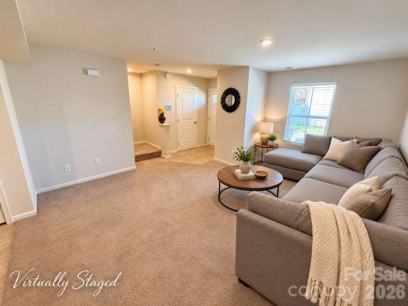 5356 Austin Knoll Court, Charlotte, NC 28269.  MLS# CAR4430727, YatesRealty ID 17213. Living room (virtually staged)