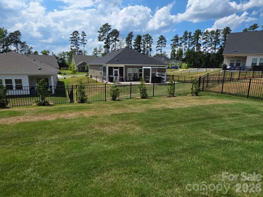 2023 Merida Street, Charlotte, NC 28214.  MLS# CAR4306693, YatesRealty ID 17217. Tree line