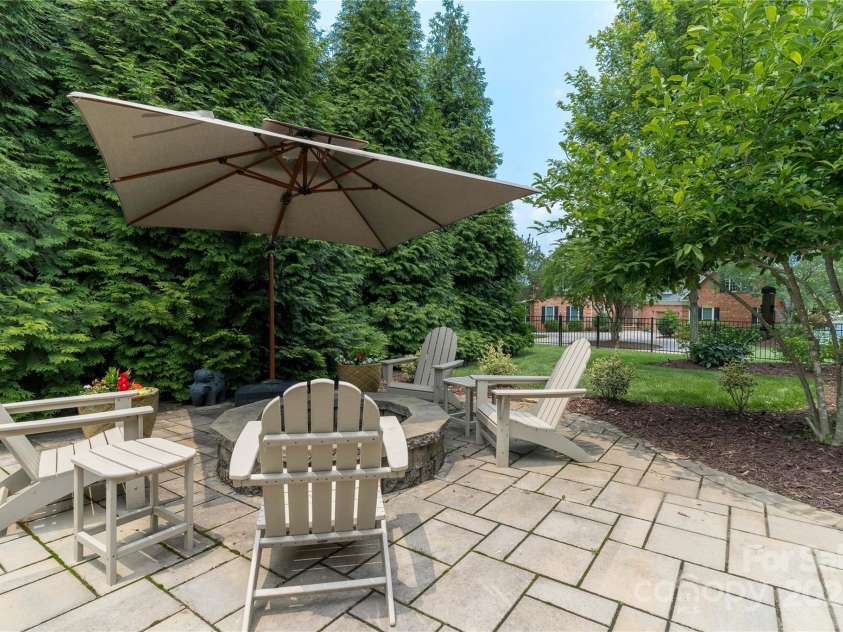 7600 Dunsmuir Court, Cornelius, NC 28031.  MLS# CAR4265951, YatesRealty ID 17217. Fire Pit on paver patio to enjoy