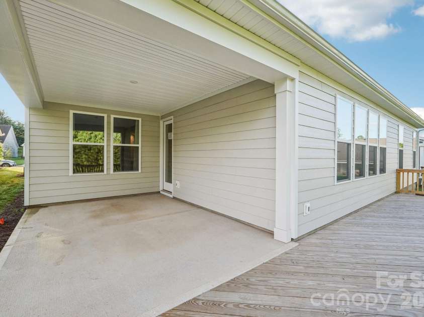 13222 Cozy Court, Charlotte, NC 28215.  MLS# CAR4362371, YatesRealty ID 17222. Covered outdoor living area designed for relaxing or entertaining in a shaded, comfortable setting.