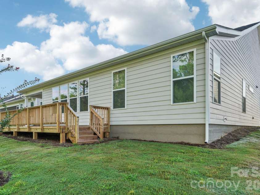13222 Cozy Court, Charlotte, NC 28215.  MLS# CAR4362371, YatesRealty ID 17222. Expansive deck offering additional outdoor space with views of the backyard.