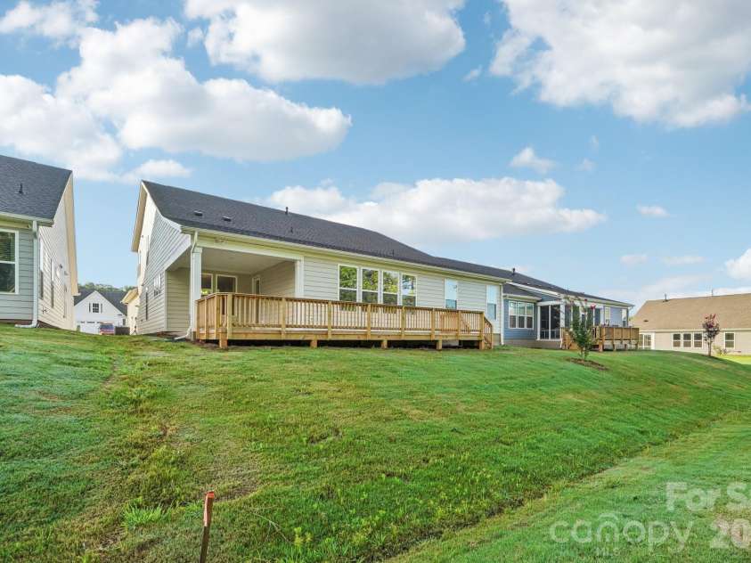 13222 Cozy Court, Charlotte, NC 28215.  MLS# CAR4362371, YatesRealty ID 17222. Rear elevation showcasing the home’s layout, outdoor living spaces, and thoughtful design.
