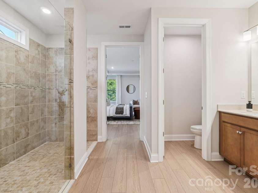 13222 Cozy Court, Charlotte, NC 28215.  MLS# CAR4362371, YatesRealty ID 17222. Spacious primary bathroom designed for comfort with a clean, functional layout.