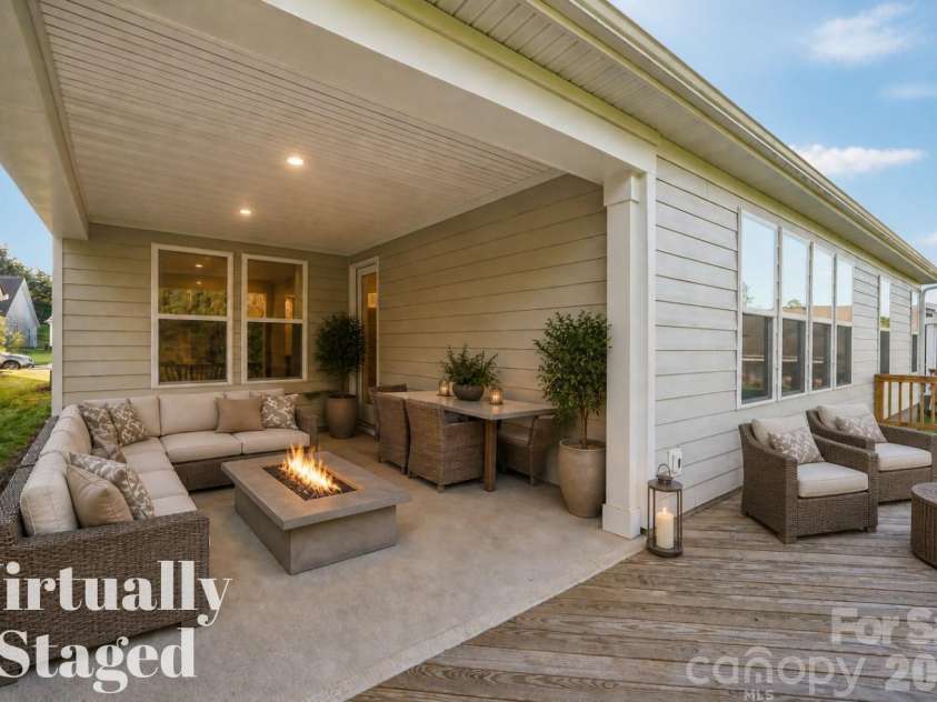 13222 Cozy Court, Charlotte, NC 28215.  MLS# CAR4362371, YatesRealty ID 17222. Staged deck area illustrating the potential for gathering and relaxation.