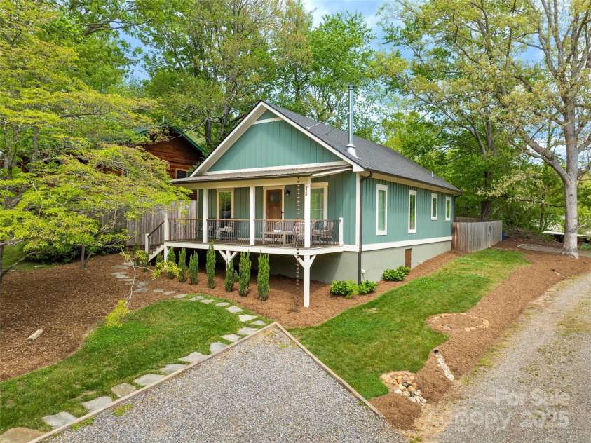 328 Mccoy Cove Road, Black Mountain, NC 28711.  MLS# CAR4248740, YatesRealty ID 17223. Sweet setting, landscaped yard and plenty of parking.