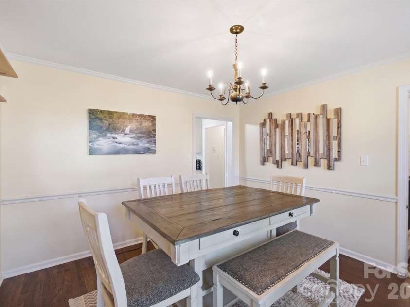 109 Elk Court, Mount Holly, NC 28120.  MLS# CAR4344317, YatesRealty ID 1724. Dining Room (Popcorn ceilings digitally removed to reflect pop-corn ceiling physically being removed in home)