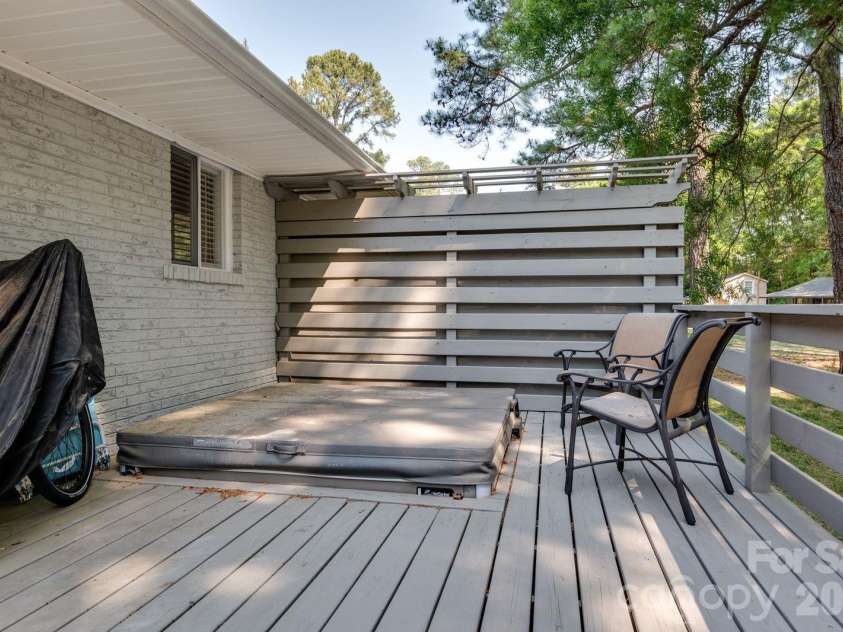 1405 Lakeview Drive, Pineville, NC 28134.  MLS# CAR4344159, YatesRealty ID 17241. Deck with your own hot tub and privacy fencing.