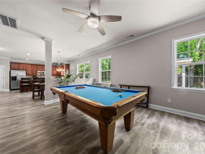 5602 Falkland Drive, Matthews, NC 28104.  MLS# CAR4371523, YatesRealty ID 17242. Wow! Big enough for a pool table but could also be a formal dining room. 