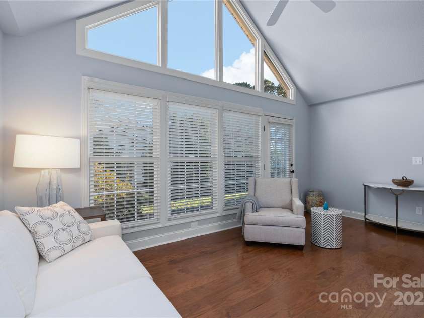 54 Lake Pointe Circle, Hendersonville, NC 28792.  MLS# CAR4323062, YatesRealty ID 1725. Sunroom with vaulted ceilings and natural light