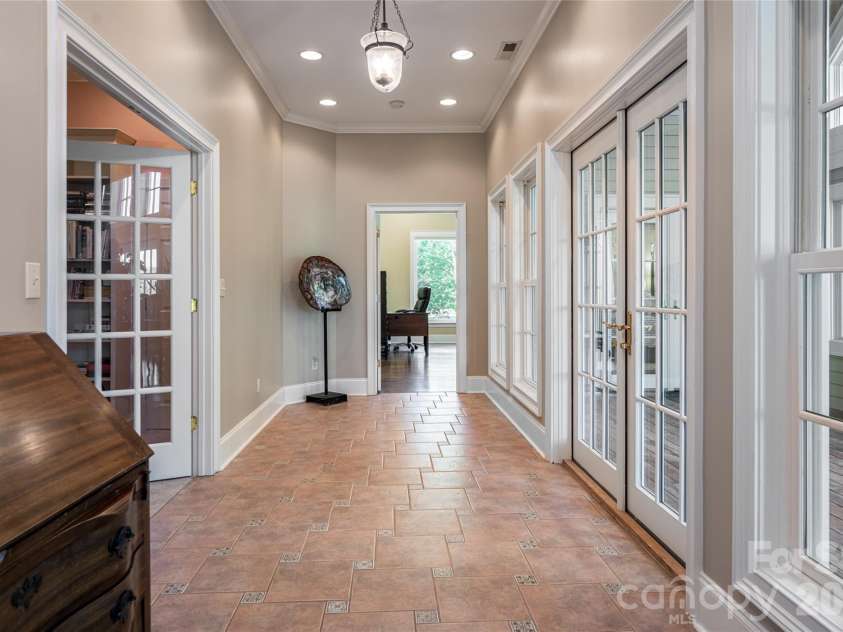 7 Ashley Road, Asheville, NC 28805.  MLS# CAR4370174, YatesRealty ID 17250. Hall to Primary, Den & Sunroom