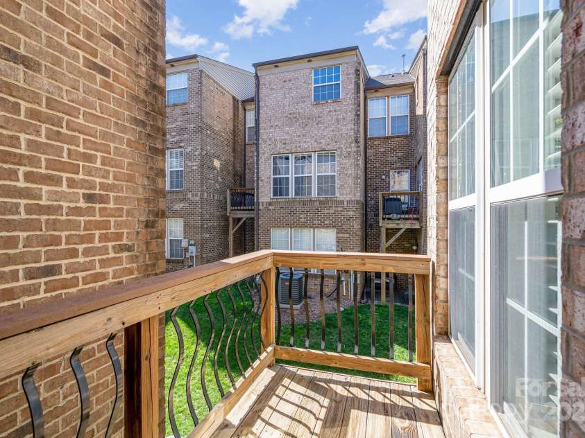 243 Lincoln Street, Charlotte, NC 28203.  MLS# CAR4259345, YatesRealty ID 17251. 2nd Floor Wood Balcony