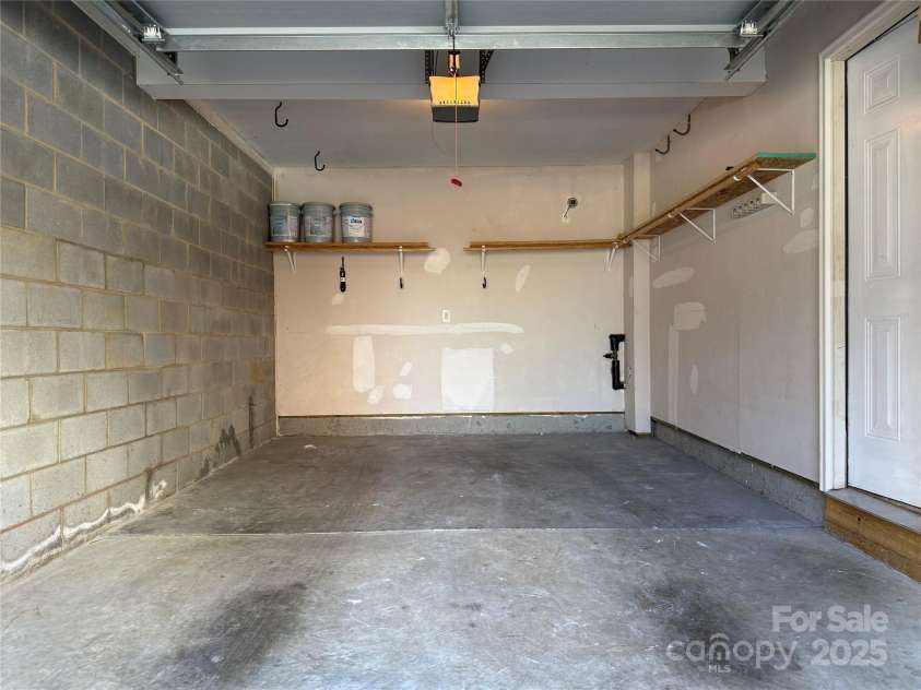 243 Lincoln Street, Charlotte, NC 28203.  MLS# CAR4259345, YatesRealty ID 17251. Inside the 1-Car Attached Garage (19'11'8')