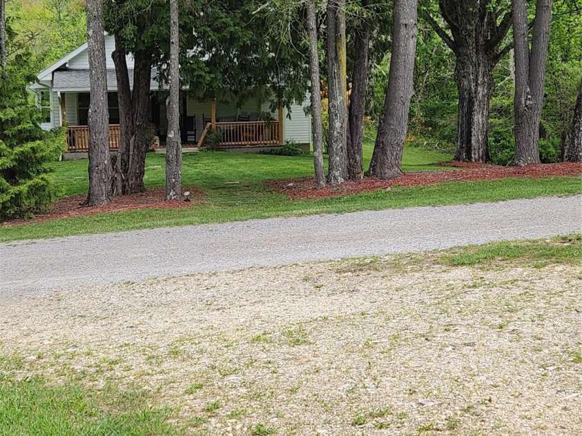 83 Kimberly Lane, Newland, NC 28657.  MLS# CAR4263748, YatesRealty ID 17257. Front view of road and home.