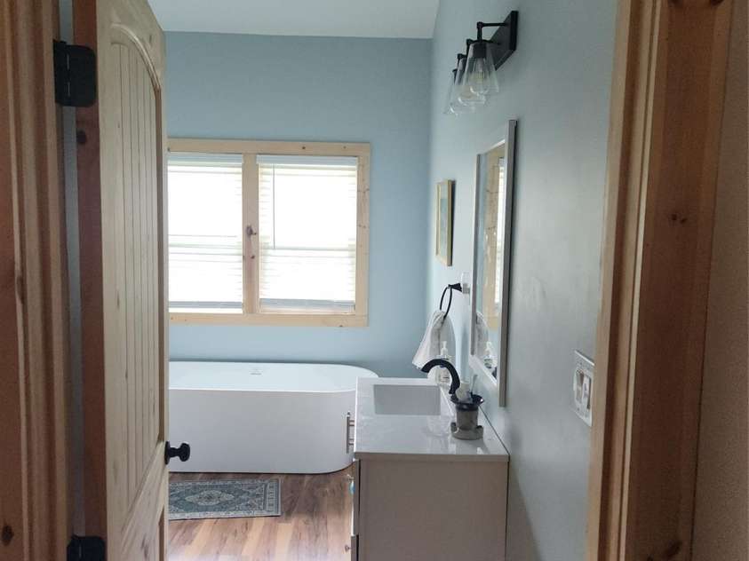 83 Kimberly Lane, Newland, NC 28657.  MLS# CAR4263748, YatesRealty ID 17257. Main bath sink and garden tub.