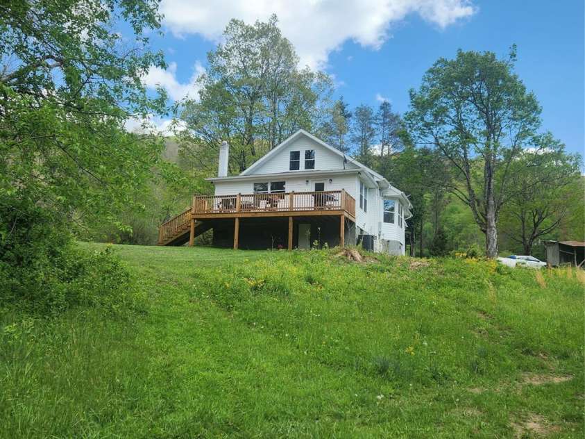 83 Kimberly Lane, Newland, NC 28657.  MLS# CAR4263748, YatesRealty ID 17257. View of home from the back.