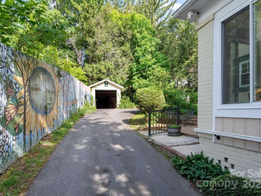 303 Country Club Road, Asheville, NC 28804.  MLS# CAR4310380, YatesRealty ID 17262. Gated Driveway with Ample Parking 