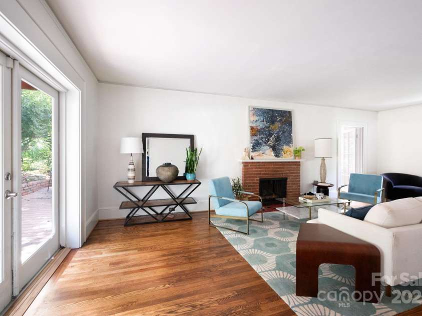 303 Country Club Road, Asheville, NC 28804.  MLS# CAR4310380, YatesRealty ID 17262. Lighted filled living room 