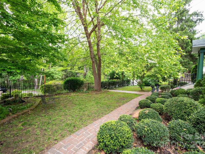 303 Country Club Road, Asheville, NC 28804.  MLS# CAR4310380, YatesRealty ID 17262. Mature Well-Manicured Yard 