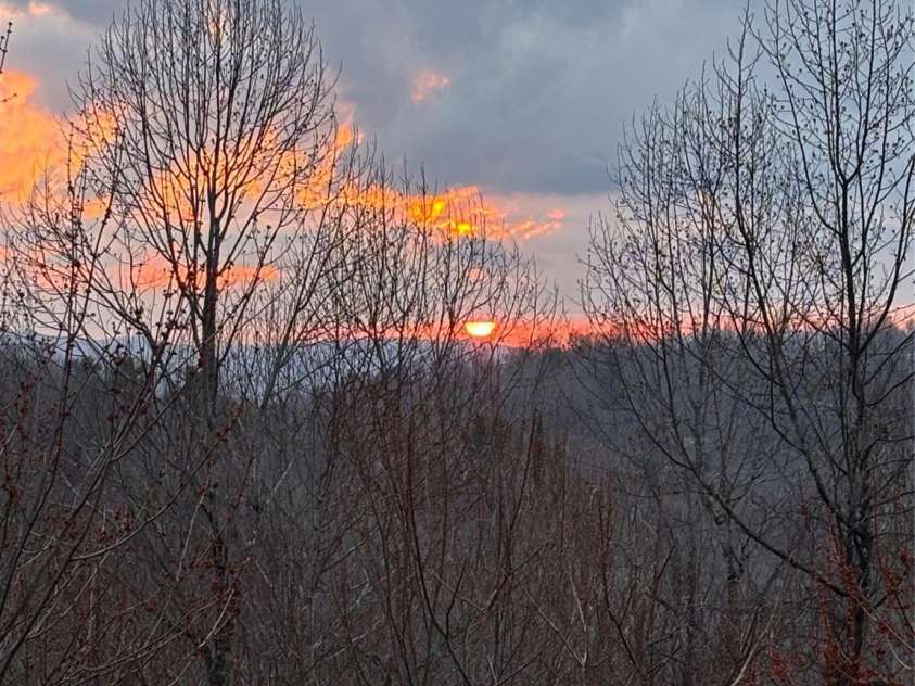 105 Spring Path, Hendersonville, NC 28739.  MLS# CAR4256171, YatesRealty ID 17277. Morning Sunrise from Deck