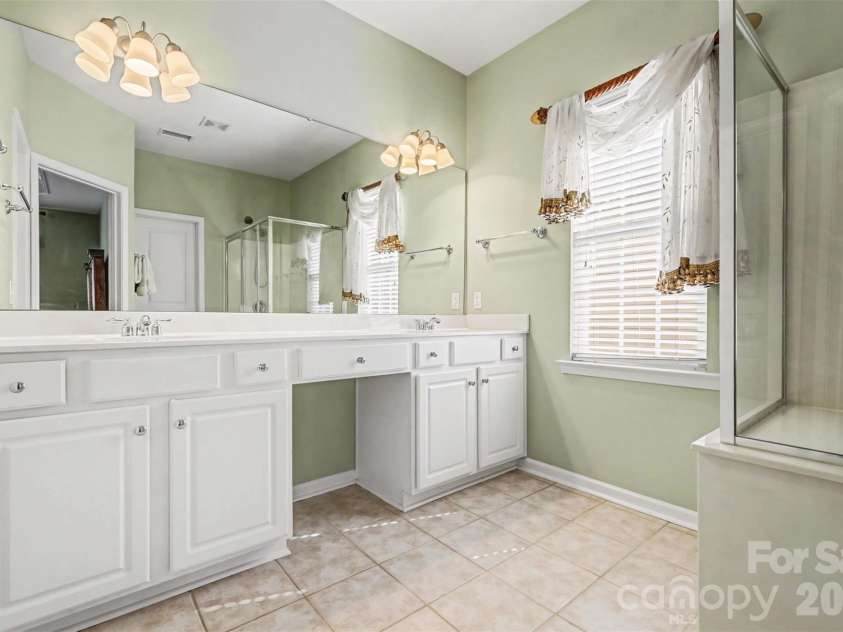 2124 Ashley River Road, Waxhaw, NC 28173.  MLS# CAR4347050, YatesRealty ID 17284. First Floor Primary Bathroom