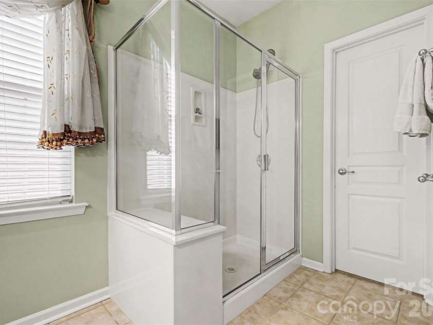 2124 Ashley River Road, Waxhaw, NC 28173.  MLS# CAR4347050, YatesRealty ID 17284. First Floor Primary Bathroom