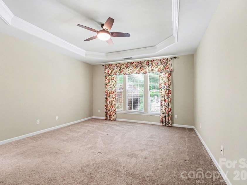 2124 Ashley River Road, Waxhaw, NC 28173.  MLS# CAR4347050, YatesRealty ID 17284. First Floor Primary Bedroom Empty