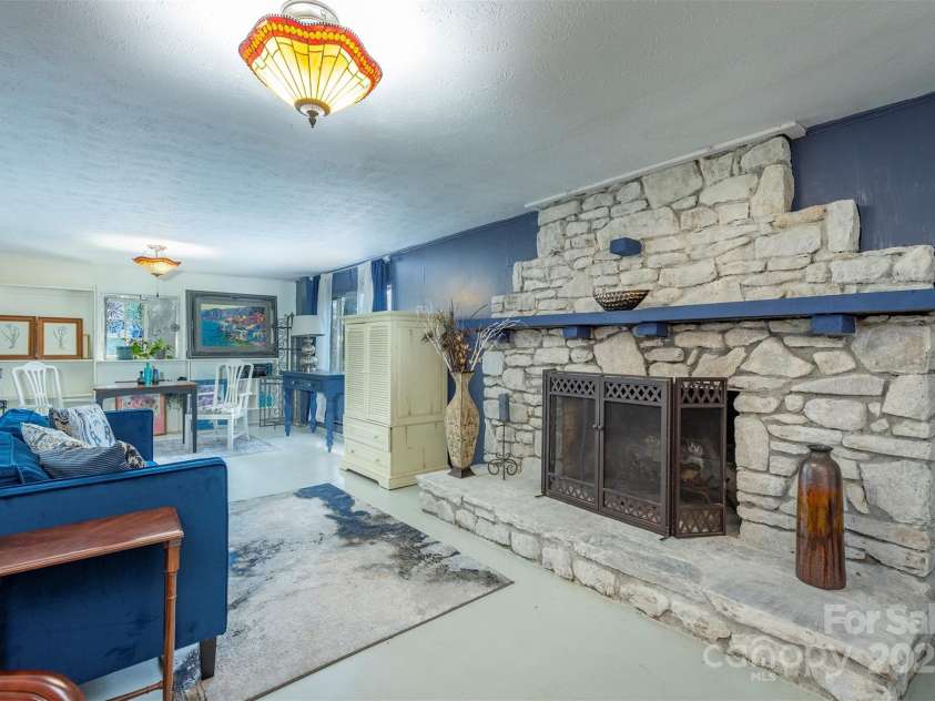 52 Oakhurst Road, Arden, NC 28704.  MLS# CAR4264311, YatesRealty ID 17288. Lower level family room