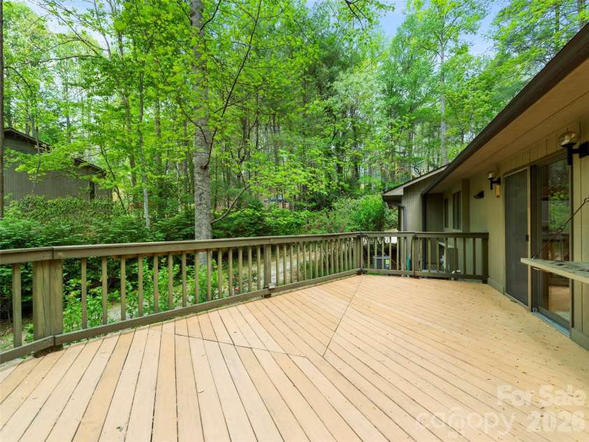 22 Delacy Drive, Hendersonville, NC 28739.  MLS# CAR4375533, YatesRealty ID 17290. Deck off Kitchen