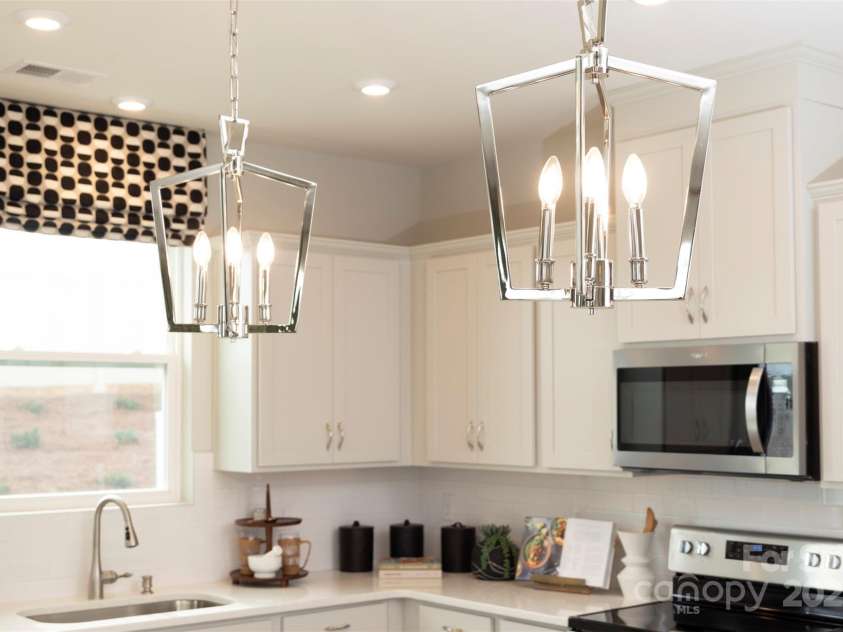 7220 Hodges Meadow Lane, Charlotte, NC 28213.  MLS# CAR4267228, YatesRealty ID 17291. Pendent lights over island