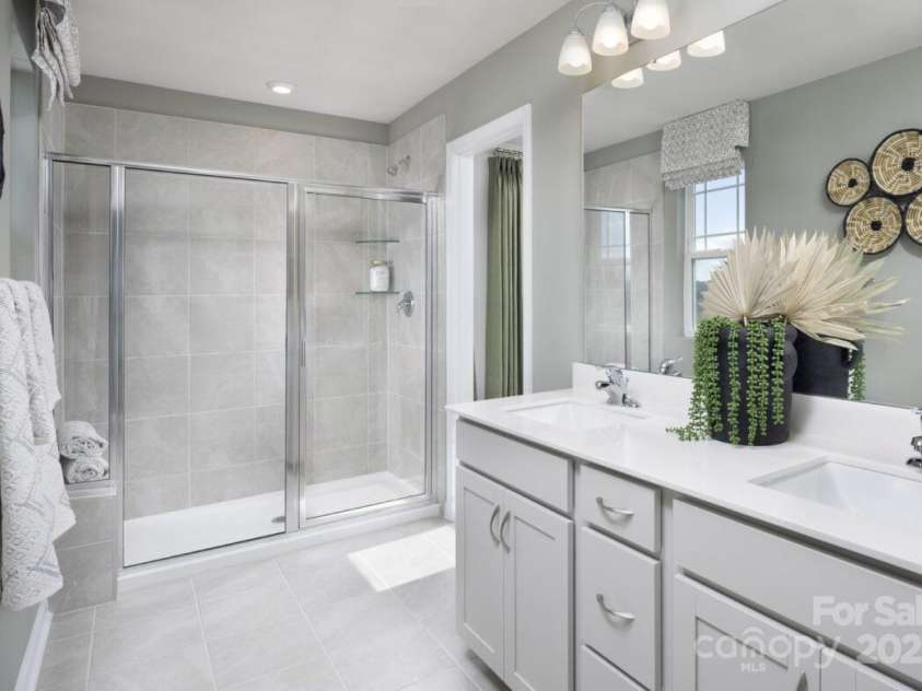 7220 Hodges Meadow Lane, Charlotte, NC 28213.  MLS# CAR4267228, YatesRealty ID 17291. Primary bath with walk in shower with seat