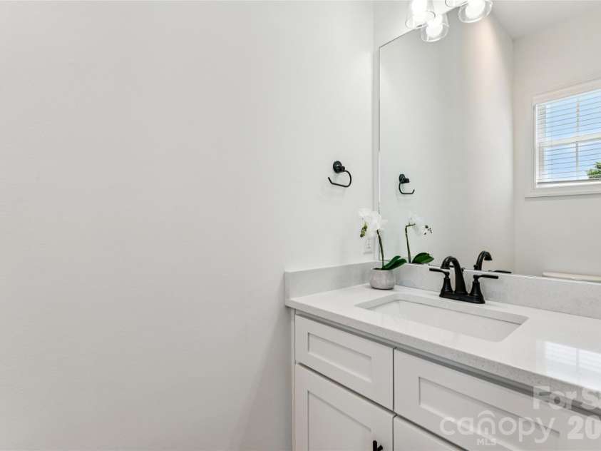 5860 Pittmon Lane, Kannapolis, NC 28081.  MLS# CAR4374434, YatesRealty ID 17292. Half bath on main floor