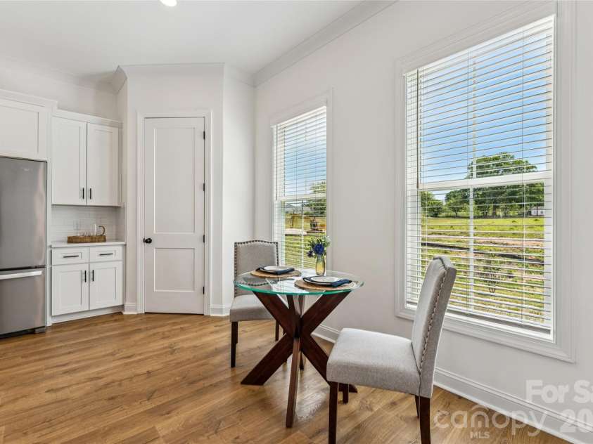 5860 Pittmon Lane, Kannapolis, NC 28081.  MLS# CAR4374434, YatesRealty ID 17292. Large windows by dining area