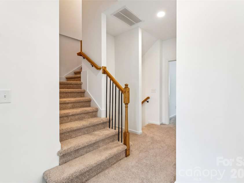 5860 Pittmon Lane, Kannapolis, NC 28081.  MLS# CAR4374434, YatesRealty ID 17292. Stairs to 3rd floor