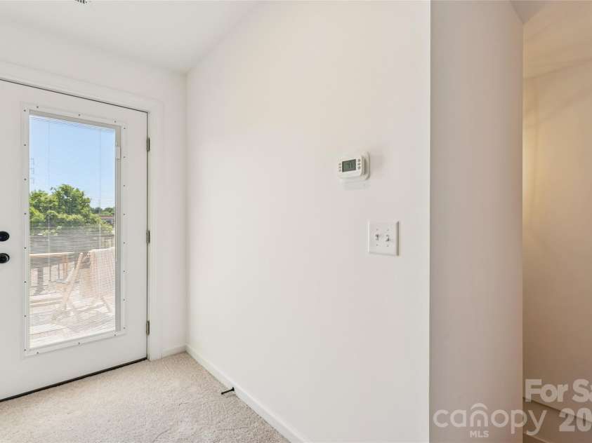 5860 Pittmon Lane, Kannapolis, NC 28081.  MLS# CAR4374434, YatesRealty ID 17292. Top floor short hallway to back deck