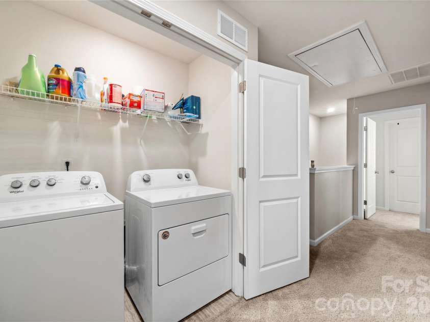 6132 Guildford Hill Lane, Charlotte, NC 28215.  MLS# CAR4373709, YatesRealty ID 17293. Upper level laundry closet