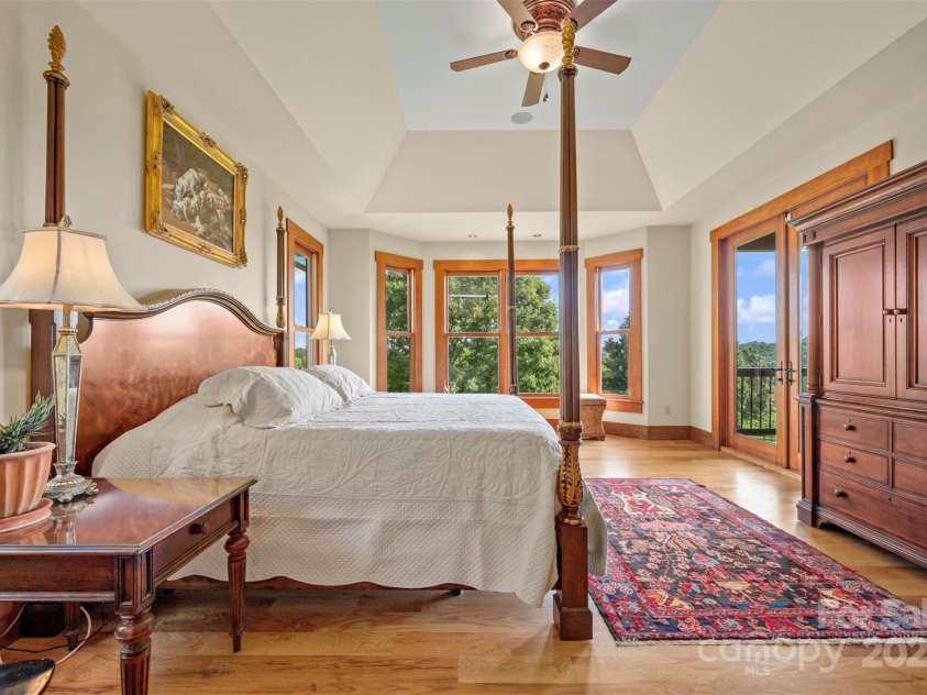 102 Uncle Coss Pond Road, Columbus, NC 28722.  MLS# CAR4267443, YatesRealty ID 17300. Main bedroom on the main floor with porch access via French doors, and horse pasture views. 