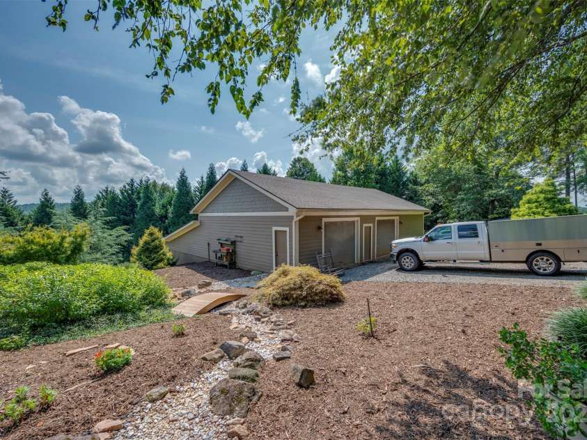 102 Uncle Coss Pond Road, Columbus, NC 28722.  MLS# CAR4267443, YatesRealty ID 17300. Separate 2,250 sqft. garage building with wood storage and potting shed, plus tractor shed over three levels.