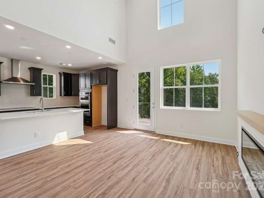 716 Flare Drive, Tega Cay, SC 29708.  MLS# CAR4267471, YatesRealty ID 17302. Great Room to Kitchen View