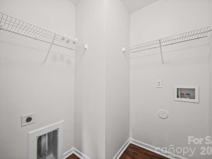 2051 Moss Creek Drive, Harrisburg, NC 28075.  MLS# CAR4344478, YatesRealty ID 1731. Separate laundry room with additional storage.